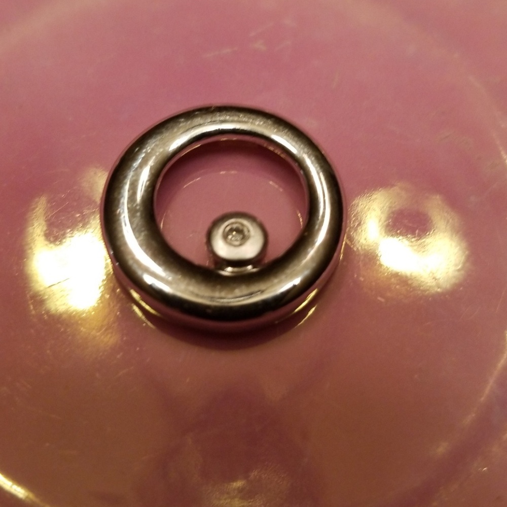 Silver pendant with diamond chip